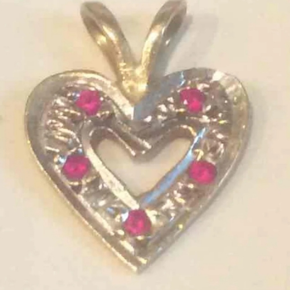 14 karat gold pendant with authentic rubys